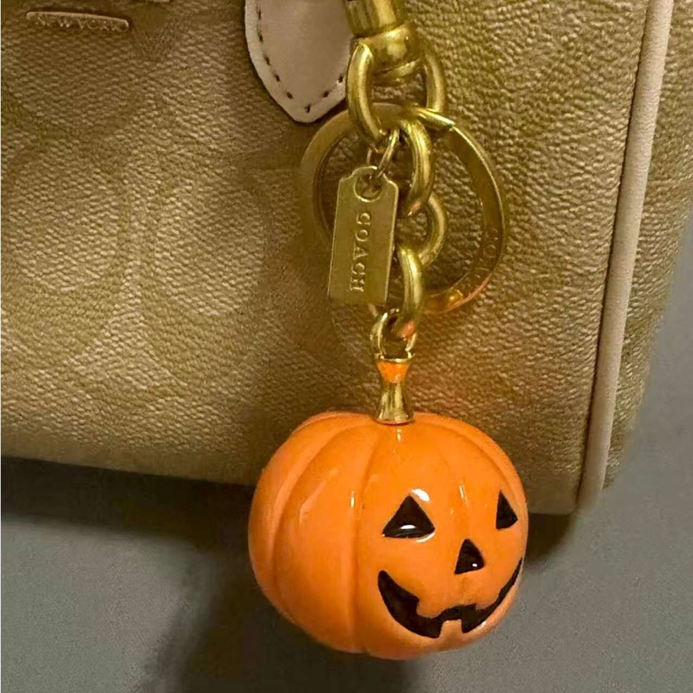 Coach Gold Shoulder Bag with Orange Pumpkin Charm